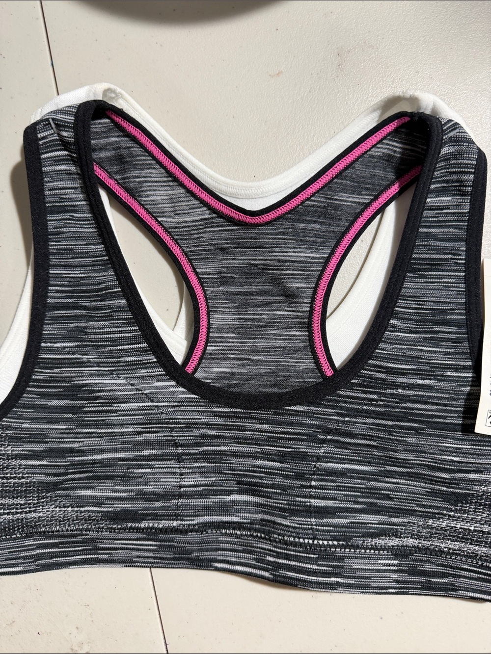 Gray Space-Dye Racerback Sports Bra with Pink Trim and one White
